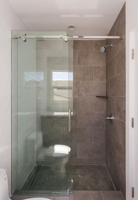 Bathroom in the master's bedroom with walk-in shower and marble heated flooring. Actual image