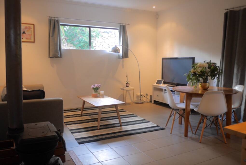 Lounge room with big screen TV, DVD player, chrome cast for movies, BOSE sound system.