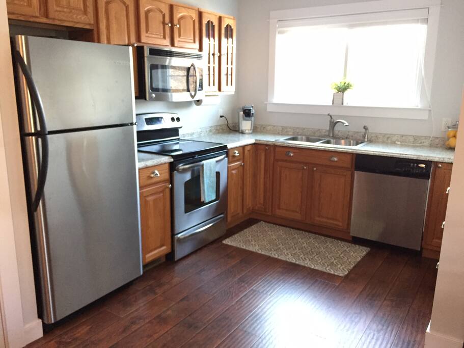 Full kitchen with stainless appliances.