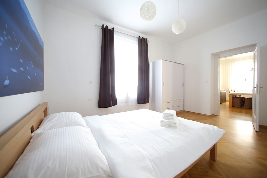 Crispy clean and ironed bedding with towels waiting for you to rest at the end of long day of sightseeing