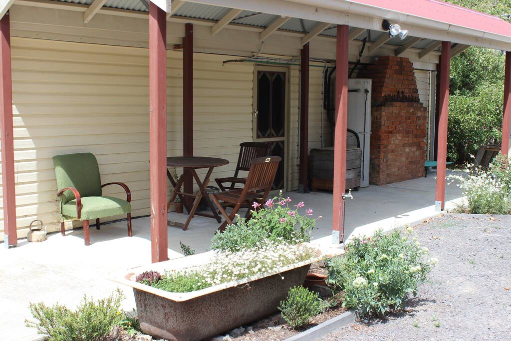 Back of house has small covered area to sit under.