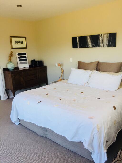 A super king bed fitted with luxurious linen.