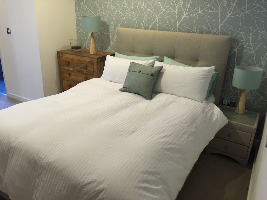 King size bed with goose down duvet and large pillows.