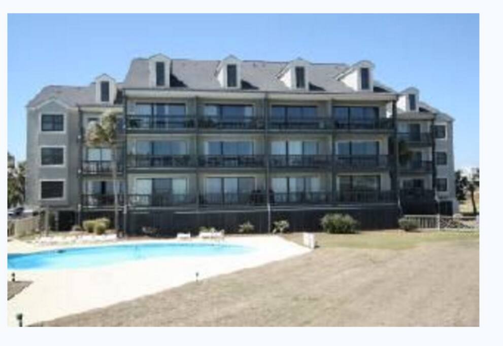 Back of the building, our unit is second from left on the first floor taken from the property line.