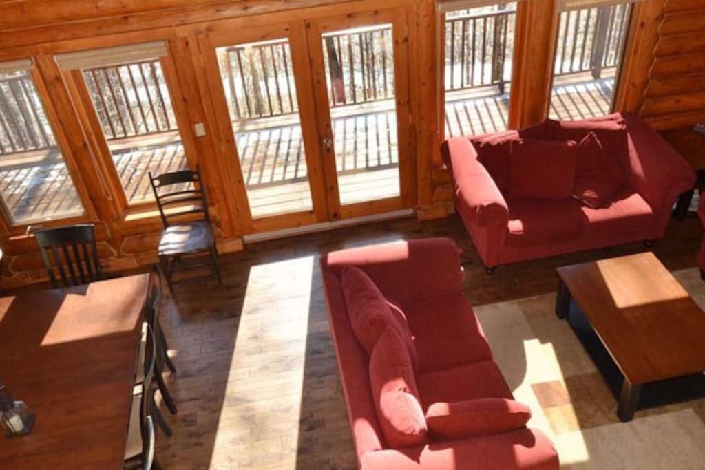 Relax and unwind in the spacious living area, complete with fireplace and flatscreen TV.