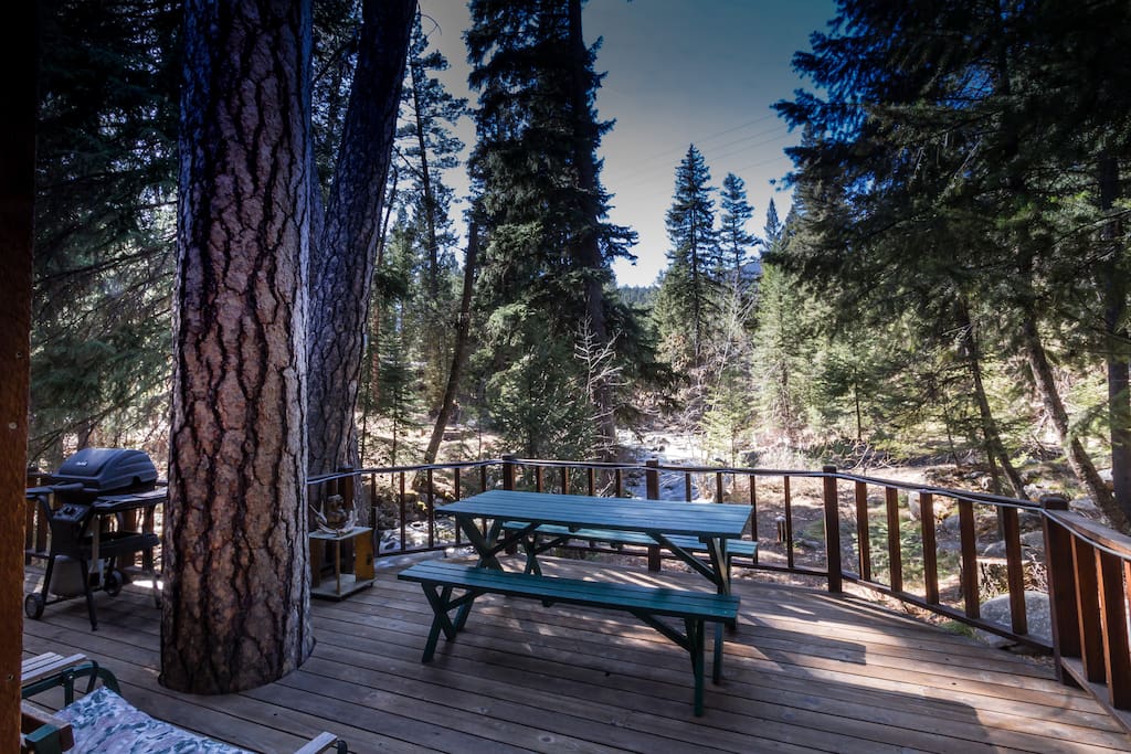 Deck looks over Boulder Creek and Bitterroot forest