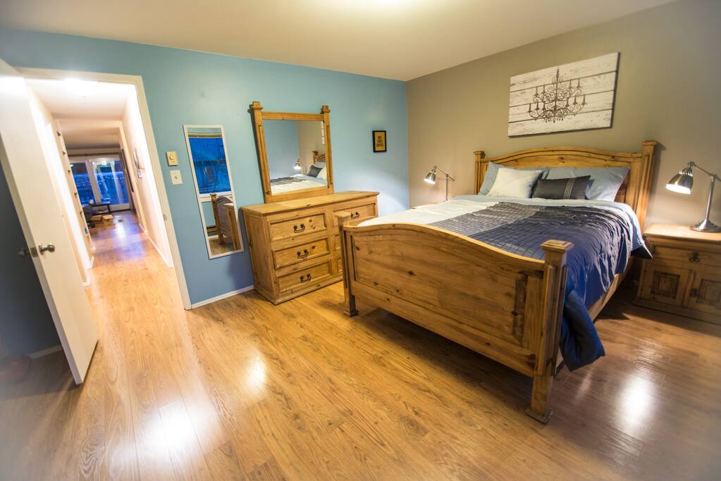Bright, spacious master bedroom with queen bed, overlooks the private, fenced, back yard.