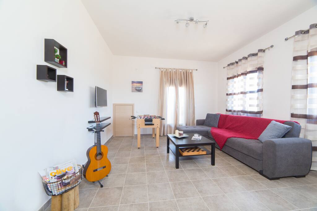 Living room for relaxing on the big sofa, gaming and smart tv.