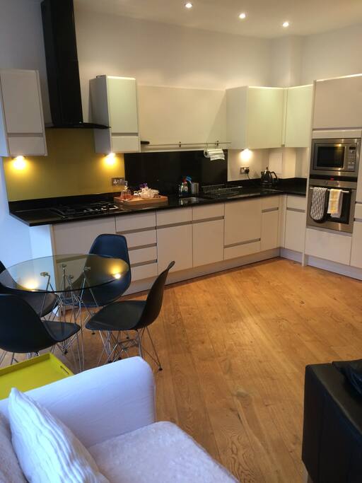 A fully fitted, well equipped kitchen with modern appliances including, dishwasher, fridge/freezer, washer/dryer, oven, microwave and hob.