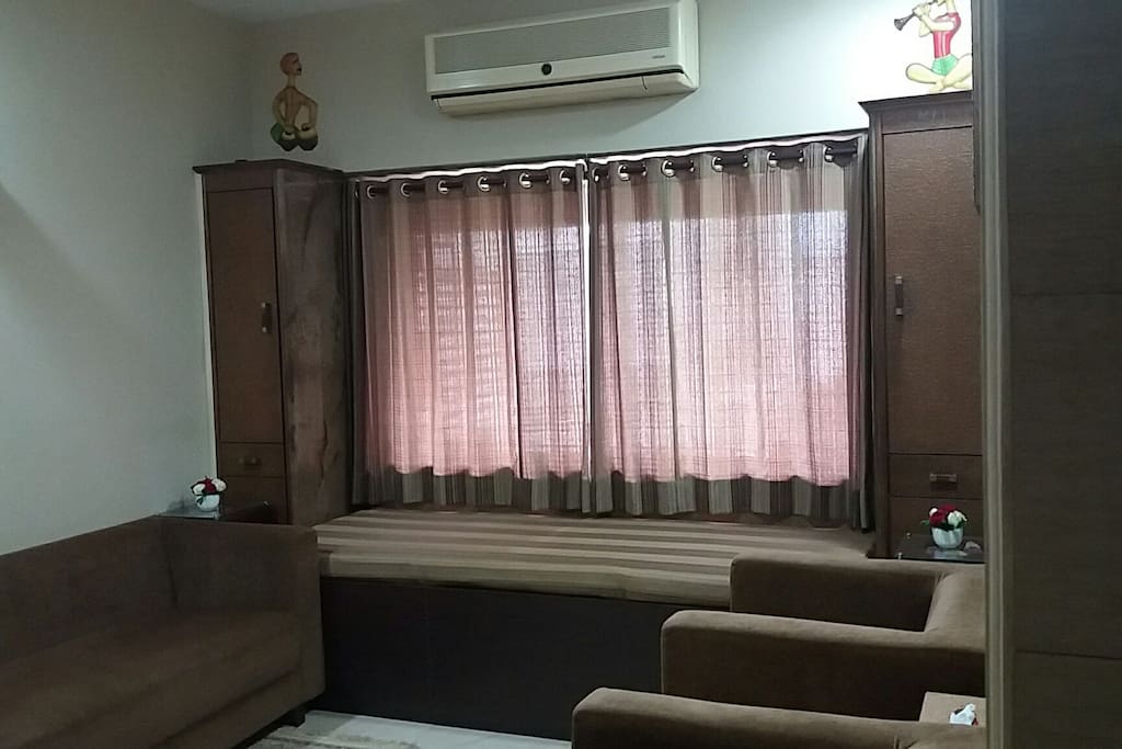 Bed for one person in living room provided.