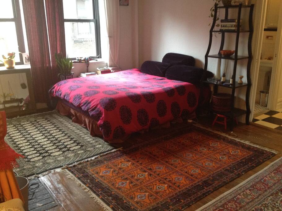 Queen size bed, southern light.