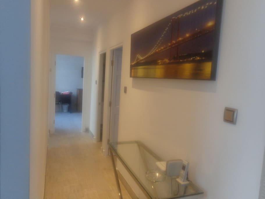 Hallway with view towards bedrooms and bathroom