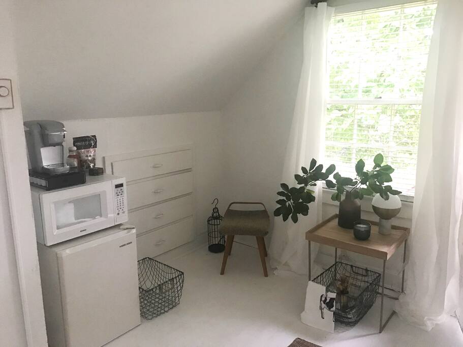 Breakfast area with Keurig, refrigerator, and microwave.