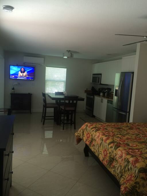 View from the bedroom area into the living space of the studio.
