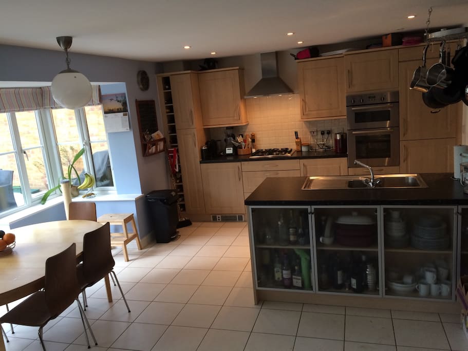 Spacious modern kitchen with seating for 8- access directly to our beautifully landscaped garden where you can enjoy a cold beer on arrival. Help yourself to tea and coffee with the Nespresso machine.