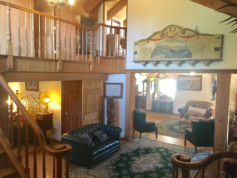 Sweeping staircase up to Master + Pony Room