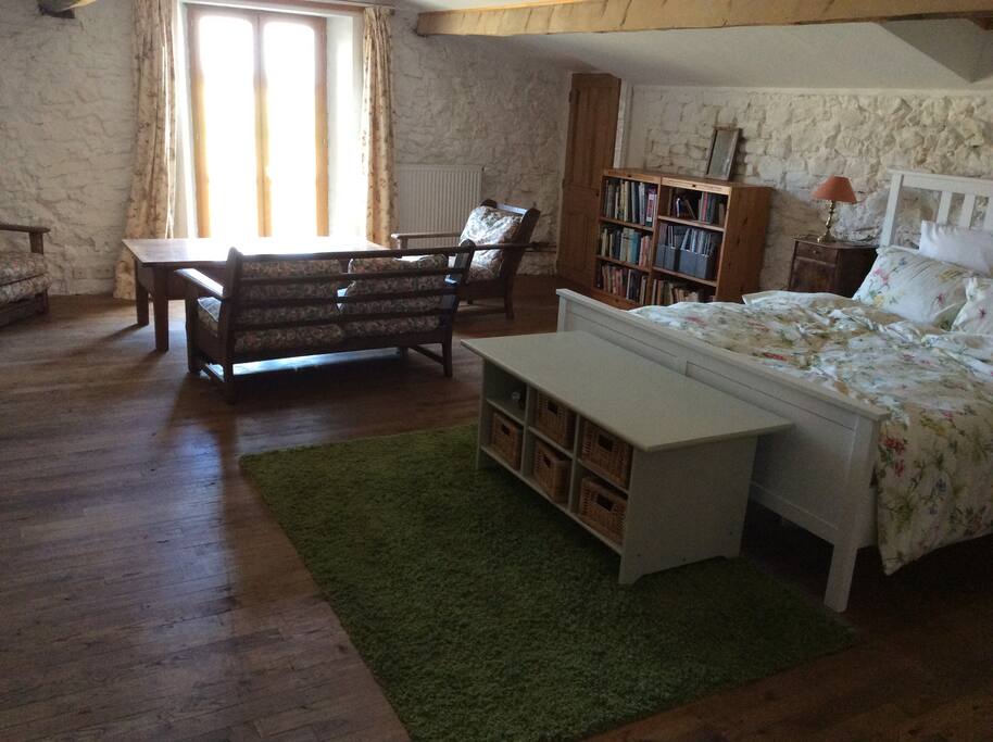 A bedroom with sitting area, ensuite and attached nursery