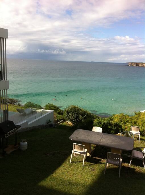 Communal backyard with table and chairs. Sit here to have your chance at seeing dolphins, whales, seals and sometimes even penguins.