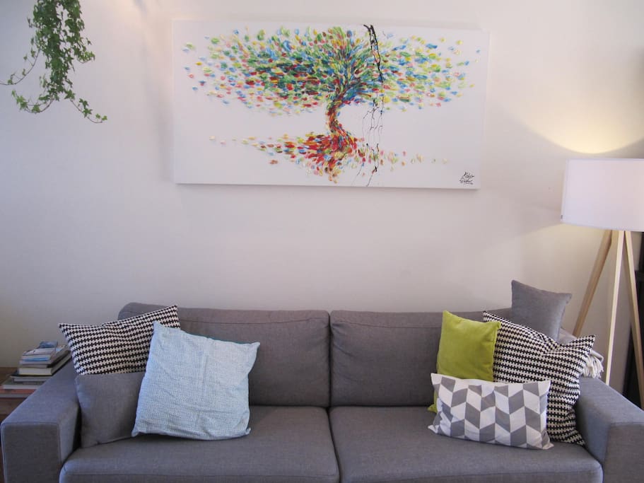 Comfortable couch and a painting from Israel