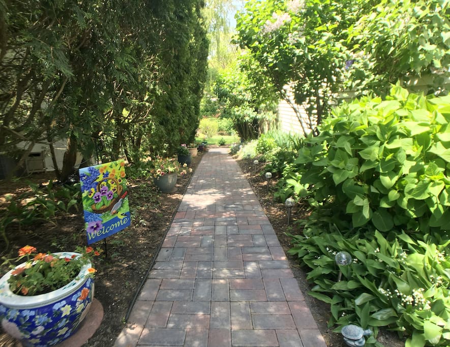 The newly laid garden pathway leads you from the included off-street parking to your patio and private entrance.