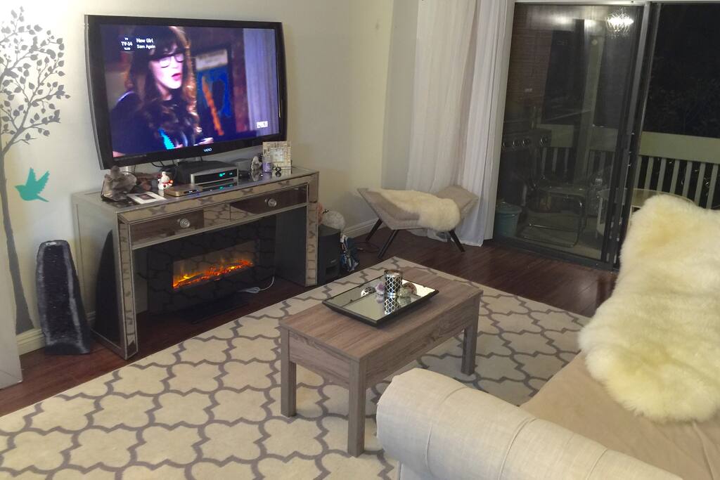 60 inch Flat screen, remote fireplace, bose system, roku and free movie streaming device!