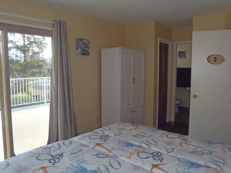 Deluxe Room-new armoire, curtains, bedding and beach decor.