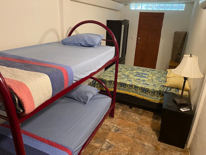 Fourth bedroom with bunk beds and full size bed.  Private access to the pool