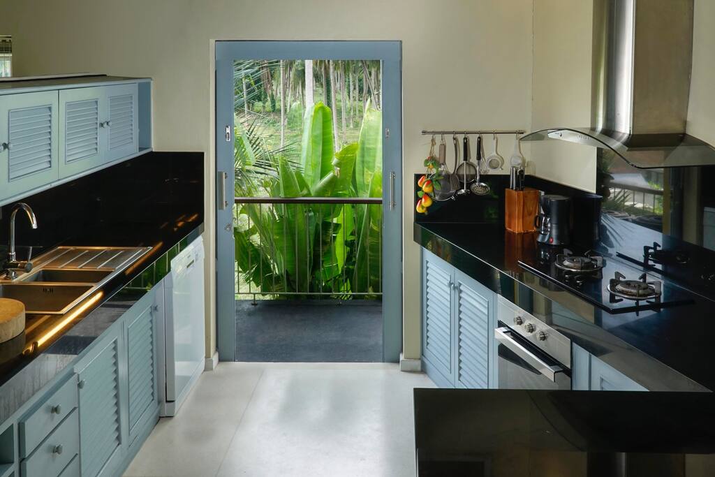 Kitchen overlooks coconut plantation