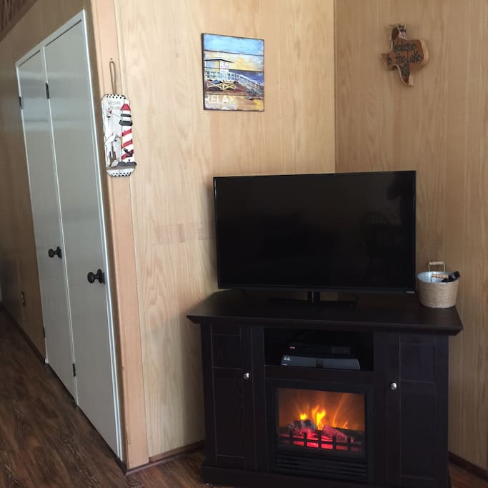 Electric fireplace, TV with DISH and DVD