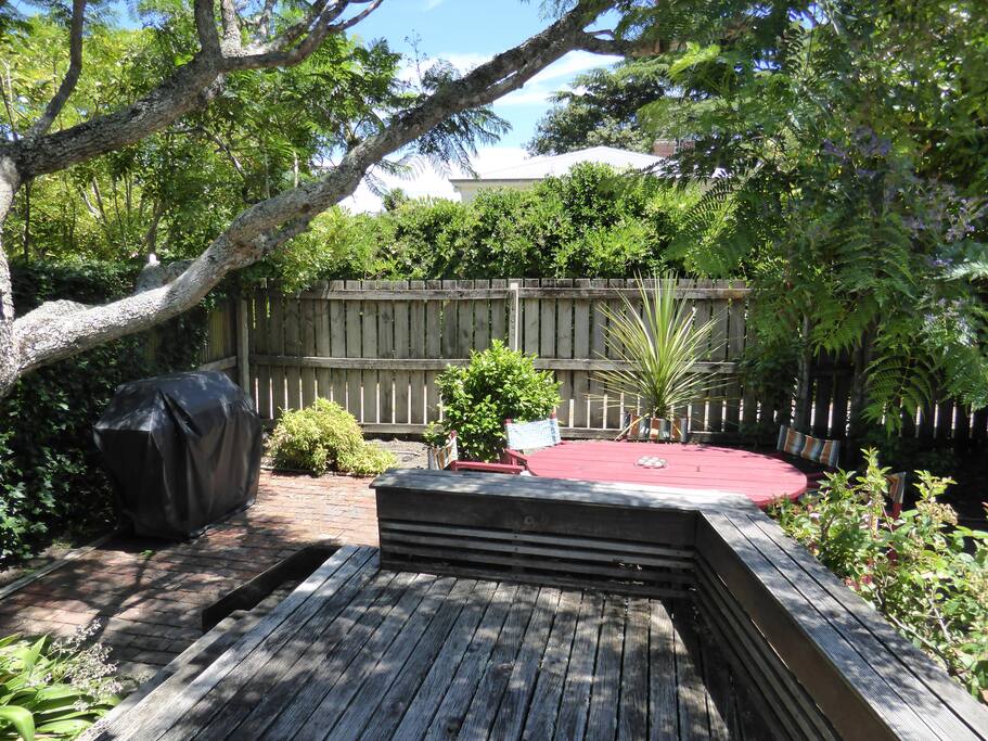 Secluded outdoor patio area with BBQ