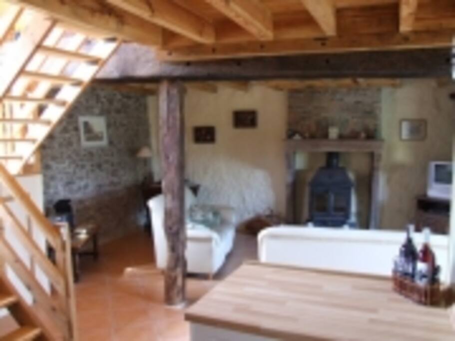 Open plan living space with a log burner