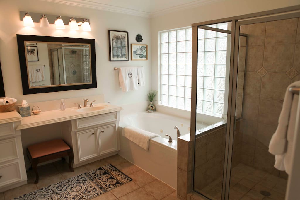 huge bathroom with double sinks, spa tub and shower