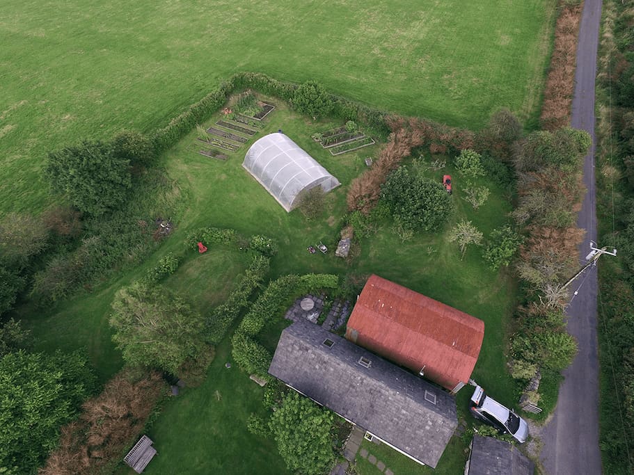 The cottage, the red barn, after which our publishing business is named, and the garden from the air. You can also see where the car parking spaces is! Photo courtesy of Lara Fritz.
