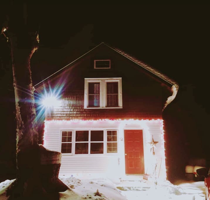Poppy Hill Cabin lit up for the winter.