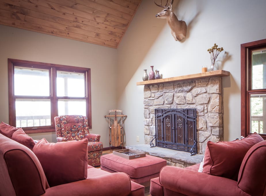 Spacious and cozy great room with large stone fireplace