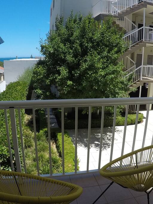 Enjoy a drink on your cozy private balcony with views across the Indian Ocean