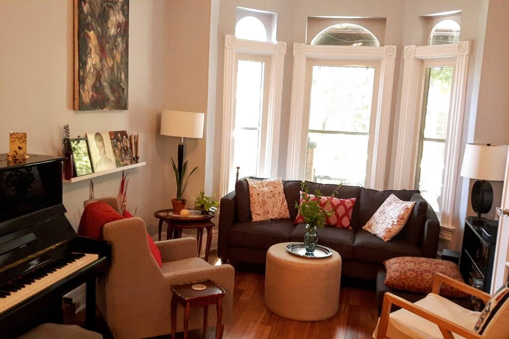 Living room with piano, please play