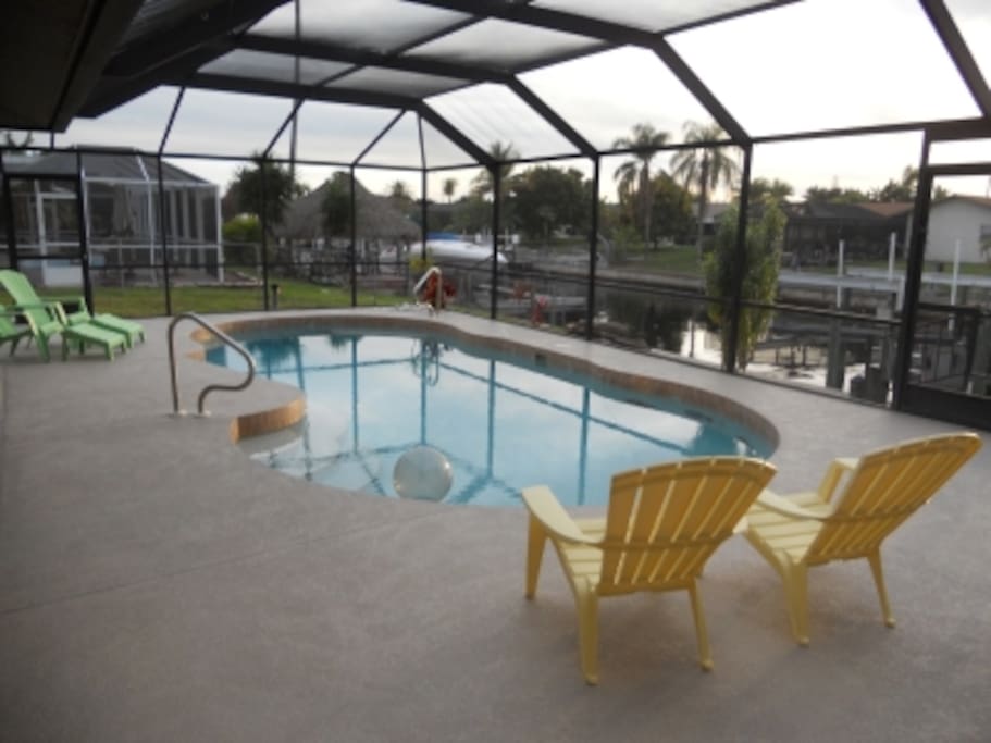 Large pool area inside lanai with grill.