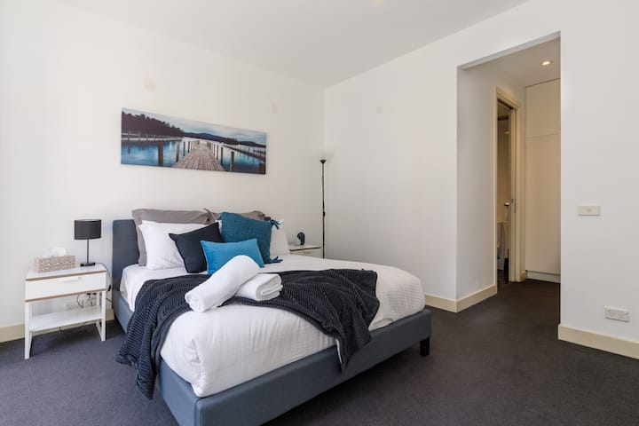 Spacious and bright Master Bedroom overlooking Collins St