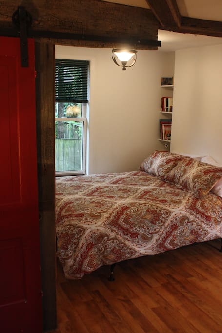 Comfortable queen size bed with surrounding barn board from Opa's barn
