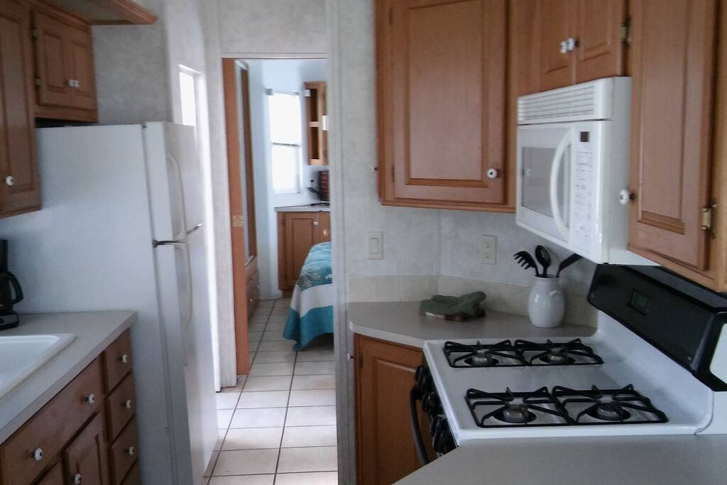 kitchen has a stove and microwave