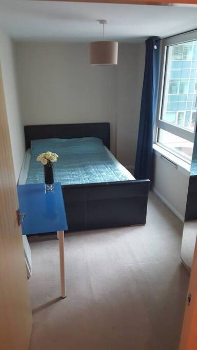 Your bedroom with king size bed, wardrobe and desk