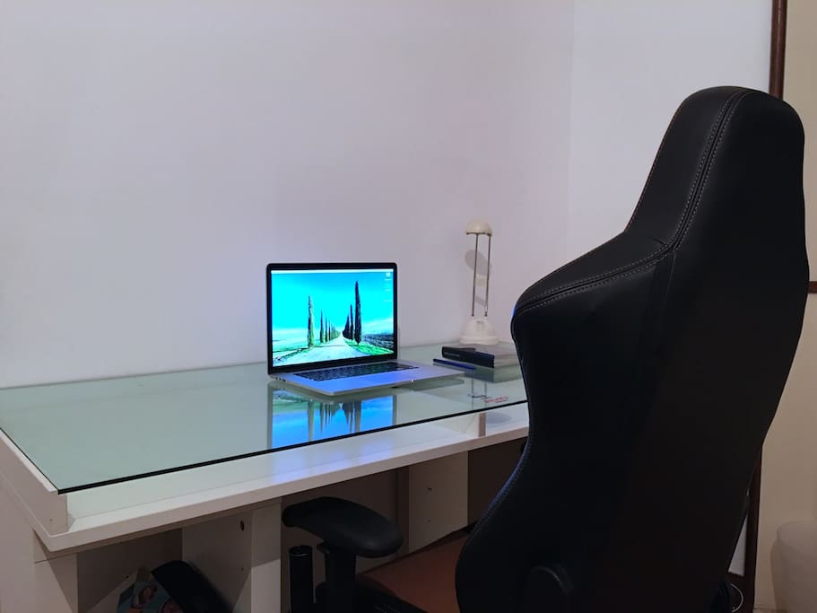 Your desk with a desk light and a SUPER comfortable chair.