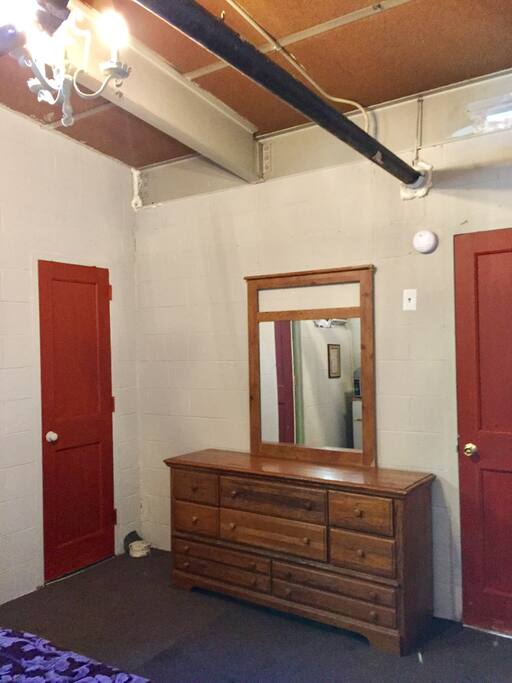 There's a dresser for putting your clothes away and a closet for hanging things up.