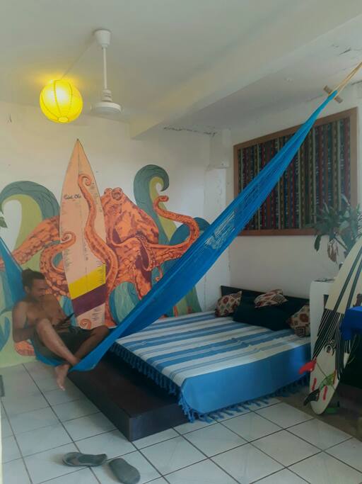 Hamac and king size couch in front of the room.