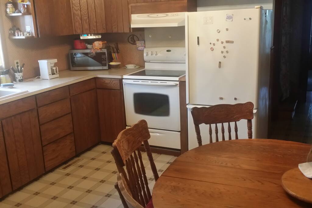 Eat-in kitchen with table space and chairs for six. Adjacent to diningroom.