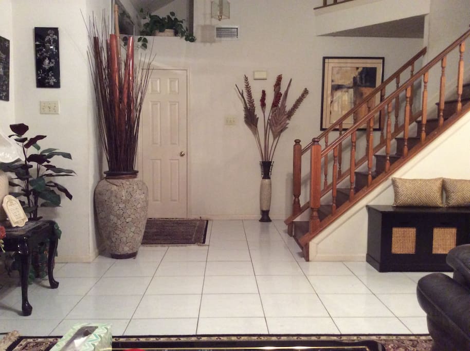 View of foyer and stairwell from living room