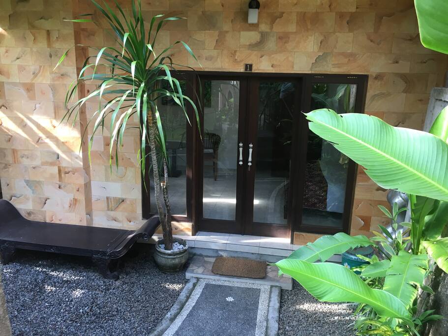 Your private entrance. Glass doors with curtains allow lots of light or privacy. View is to the garden.