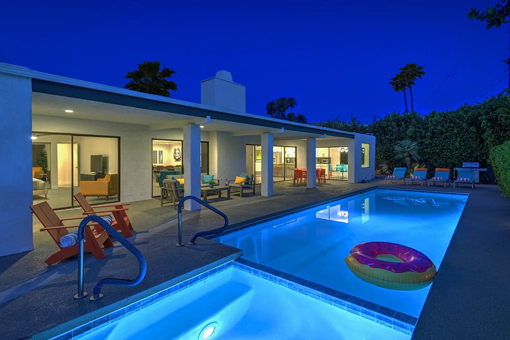 NIGHT BACK OF HOUSE REVERSE - TWIN PALMS TRANQUILITY - PALM SPRINGS VACATION RENTAL POOL HOME