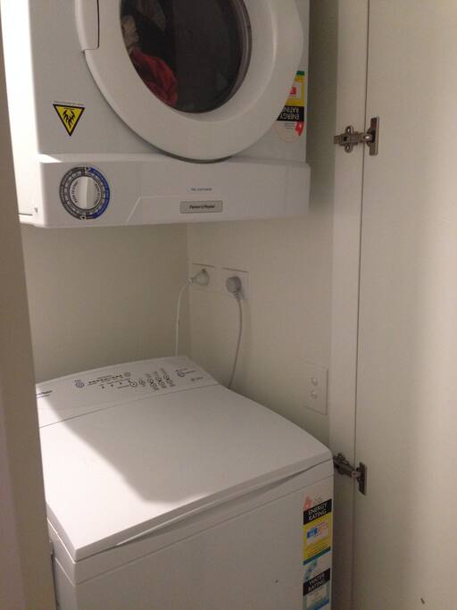 Laundry - washing machine and dryer inside apartment